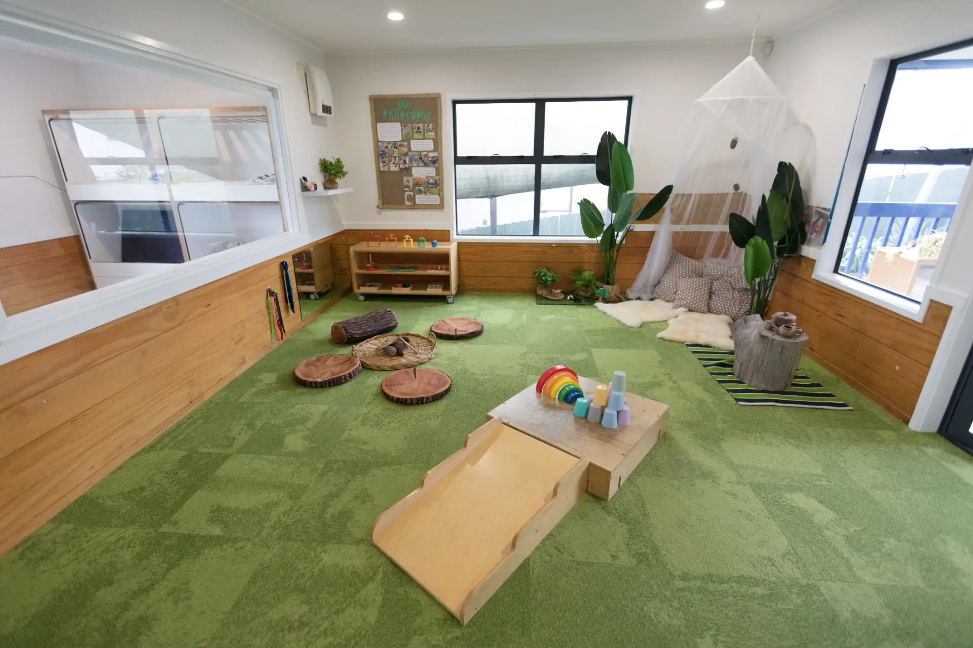 The Fantail Room at Growing Minds, a calm green play space set up for babies to learn and grow